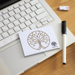 a notepad and pen on a laptop post it personalizzati note adesive