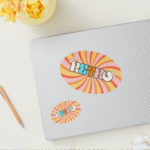 a laptop and a pencil on a table adesivi ovali in bobina foglio